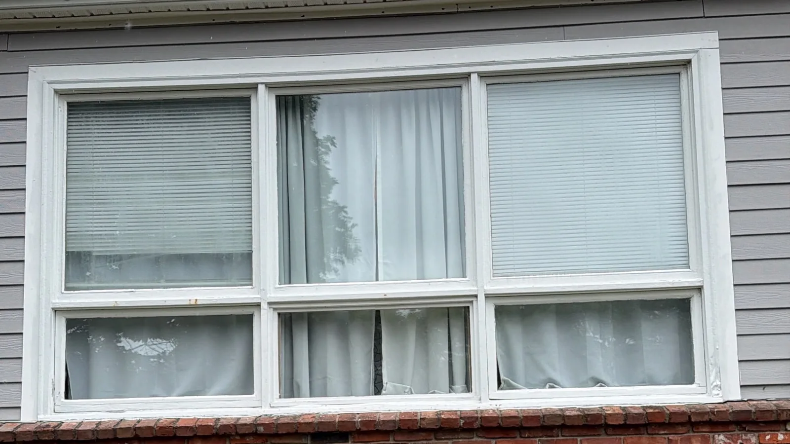 Original three-section window assembly before replacement at a Plymouth, MA home